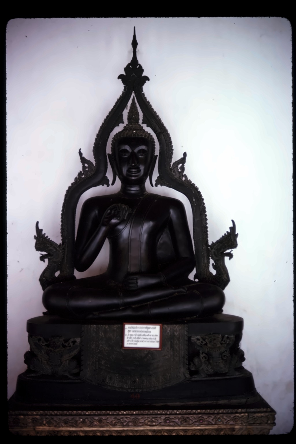 Buddha on ornate pedestal